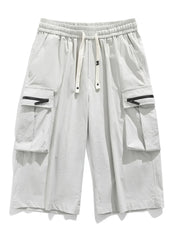 Light gray cargo shorts with zippered pockets and drawstring waist