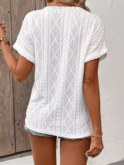 White short-sleeve t-shirt with a diamond pattern and textured fabric.