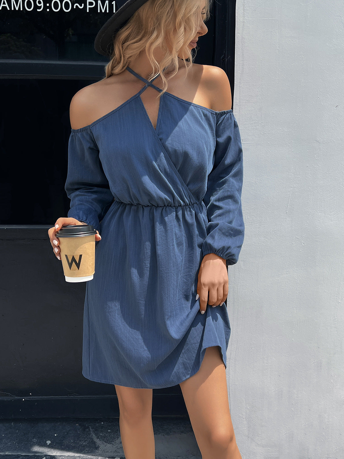 Dusty blue off-shoulder mini dress with cross-strap neckline and cinched waist
