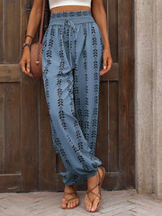 Cerulean ankle trousers with indigo leaf print, gathered waist and ankles.