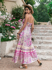 Pink floral print viscose maxi dress with spaghetti straps and tiered skirt.