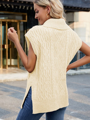 Cable knit turtleneck vest in tan with side slits, acrylic material.