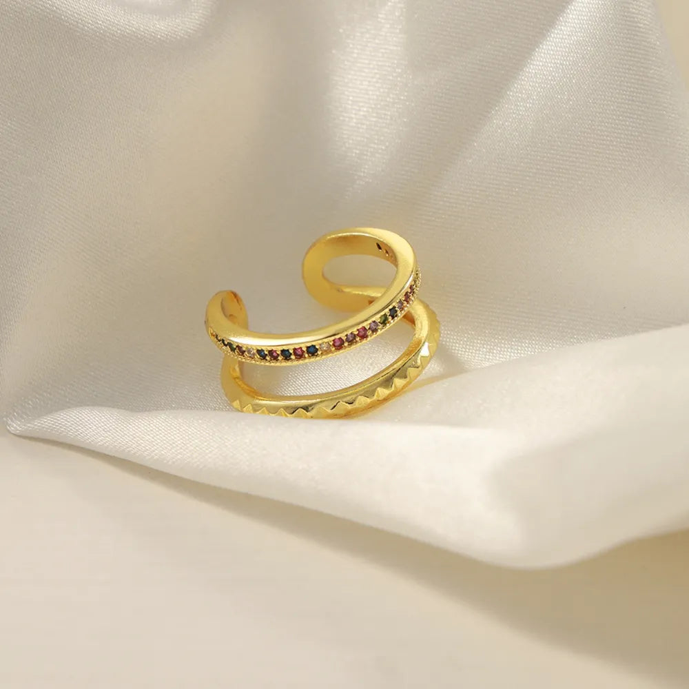 Double band ring with multicolor pavé stones and textured detail.