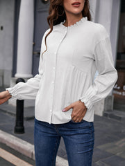 White textured ruffle collar peplum blouse with button front and ruffled cuffs.