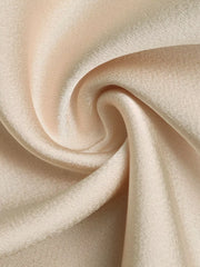Elegant V-neck ruched bodysuit in a soft beige satin fabric with subtle texture.