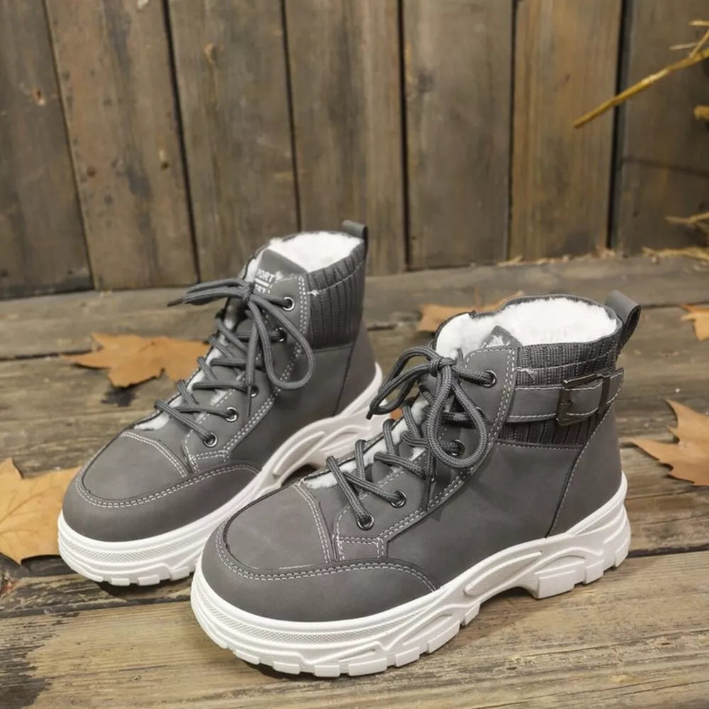 Dark gray lace-up boots with plush lining and knit accents.