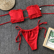 Red bandeau bikini set with ruffles and tie sides.