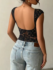 Black lace cap-sleeve maternity t-shirt with a low back, styled with light wash jeans.