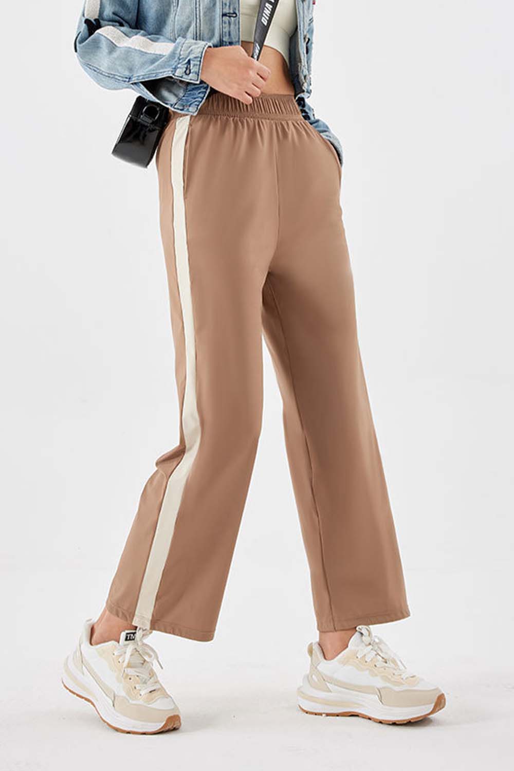 Camel relaxed trousers with side stripe detail and elastic waistband.