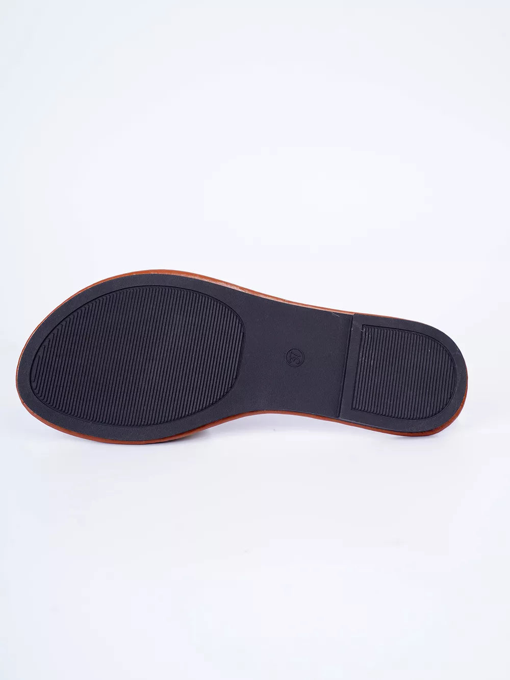 Embroidered artisan open-toe sandals sole detail, black rubber sole with textured grip.