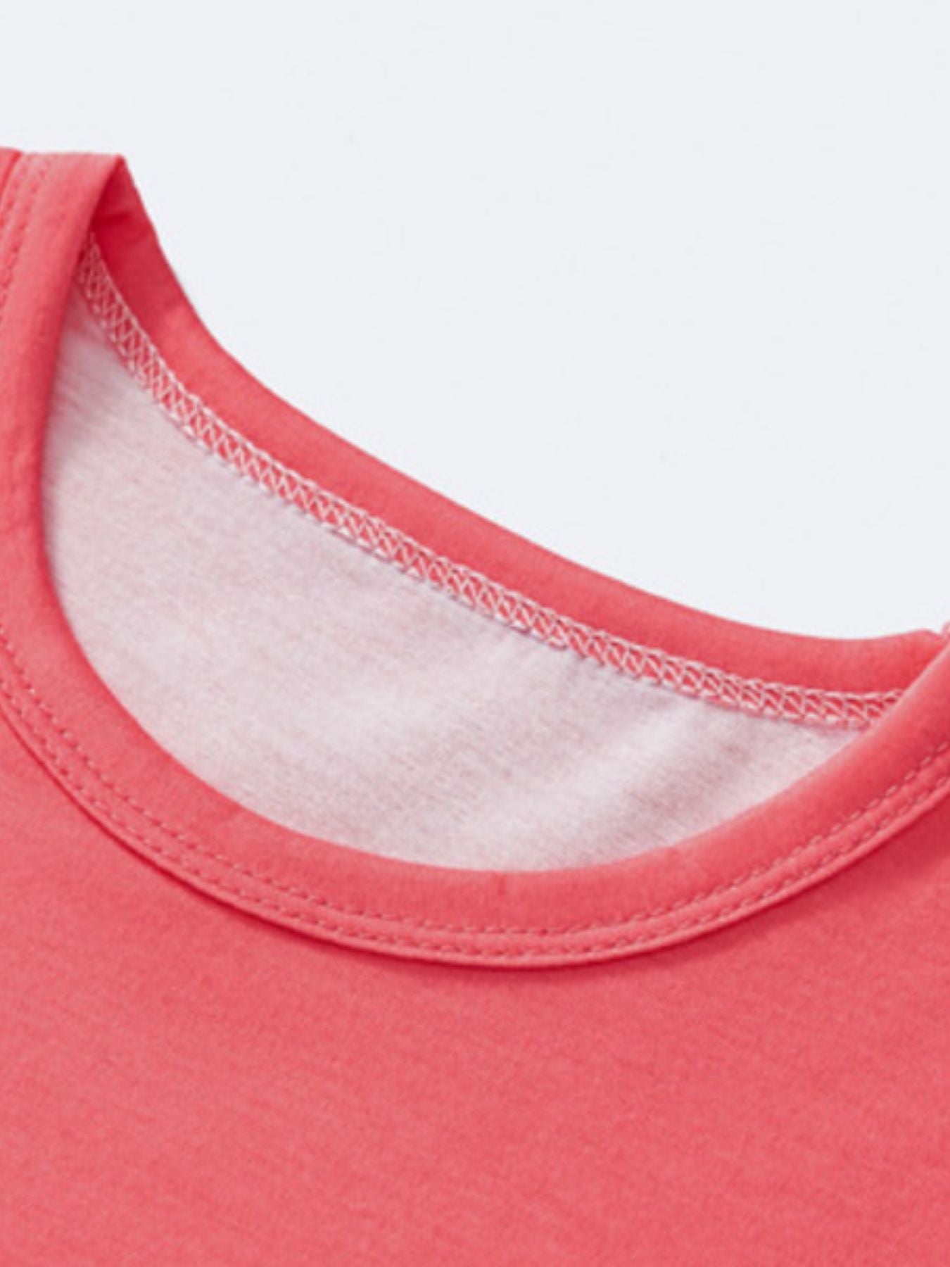 Coral baby tee neckline detail with white stitching