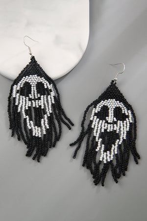 Beaded skull fringe earrings in black and white with dangling strands.