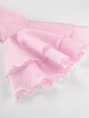 Blush pink ruffle trim long sleeve blouse with dramatic sleeves and ruffled cuffs.