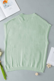 Sage knit sleeveless top with mock neck and ribbed trim.