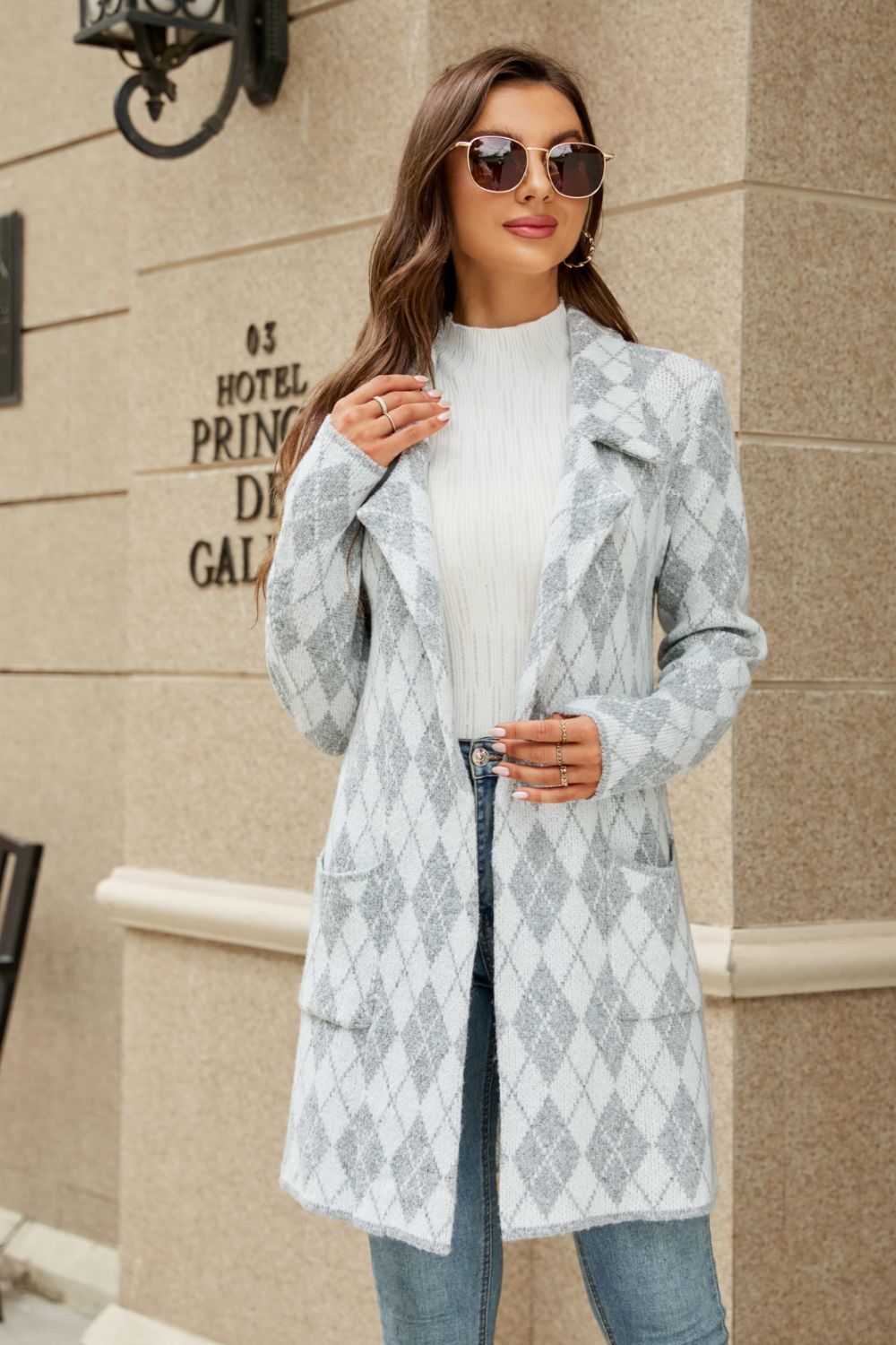 Grid-print knit blazer coat in gray and white with pockets and lapels.