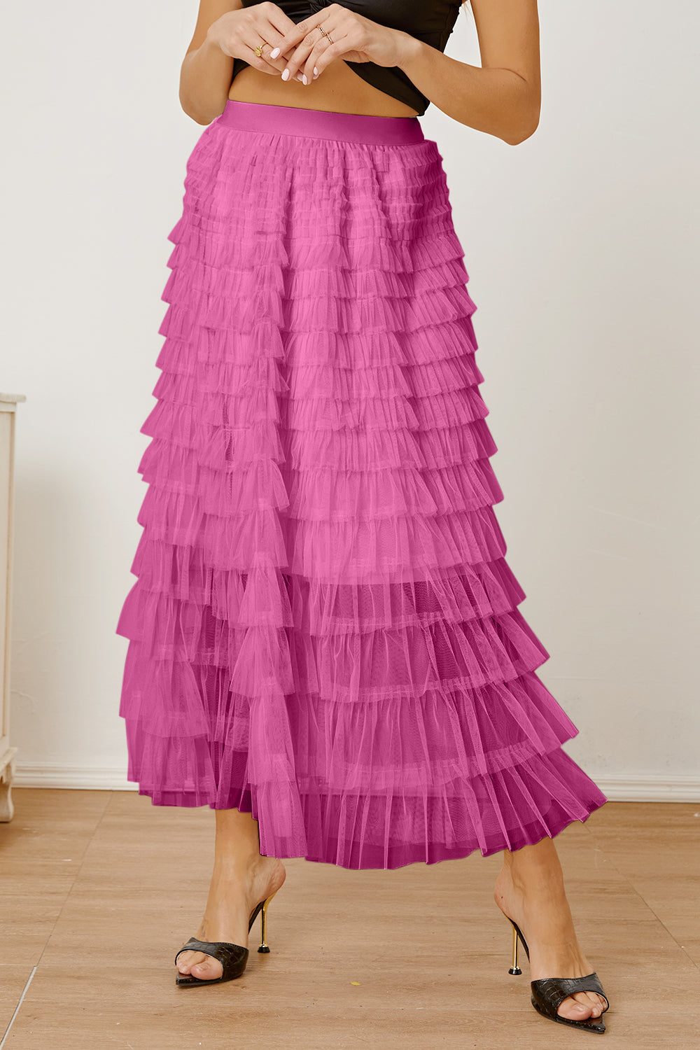 Pink tiered tulle maxi skirt with a ruffled hem