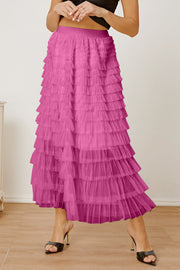 Pink tiered tulle maxi skirt with a ruffled hem