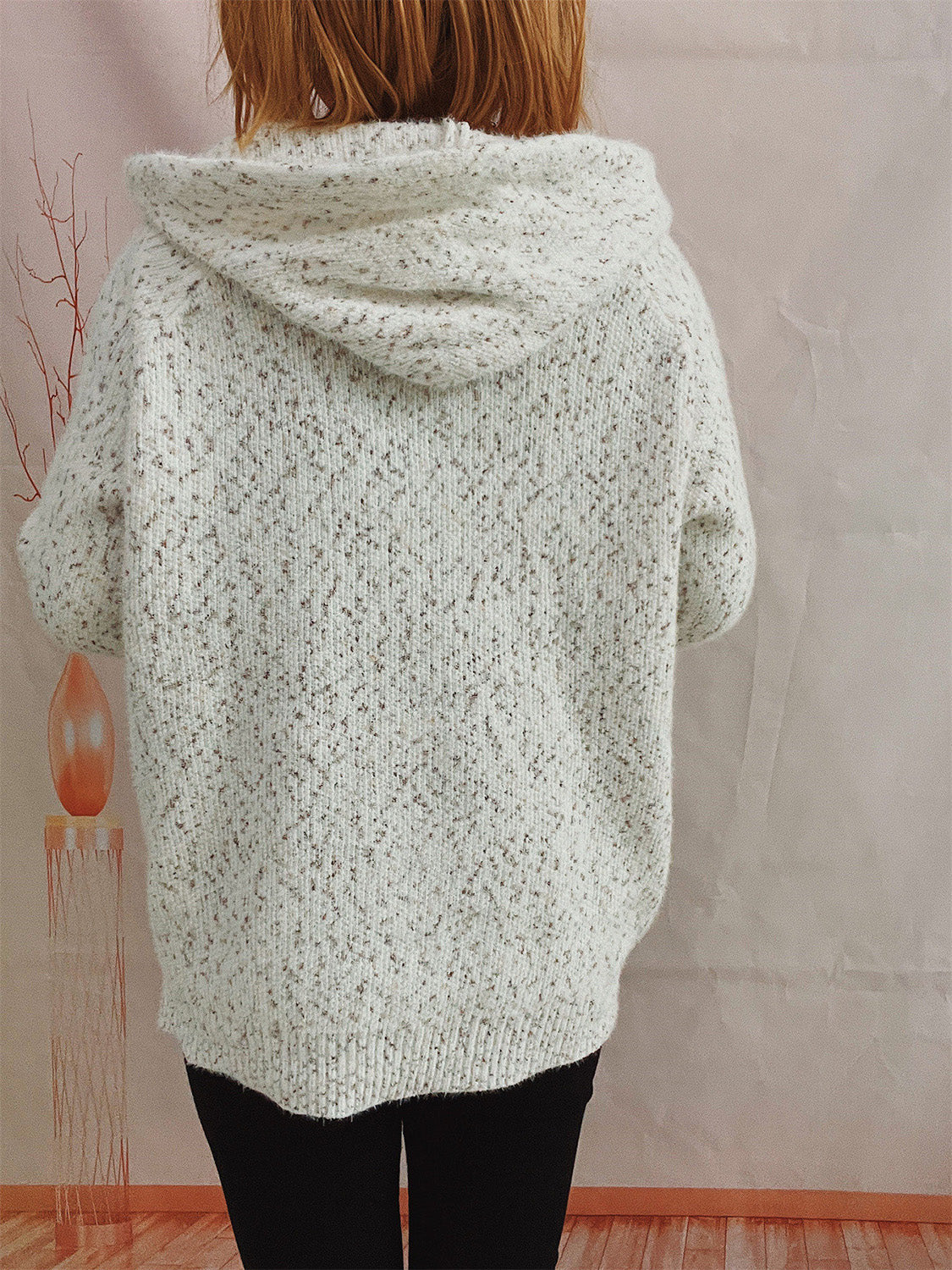 Speckled knit relaxed zip-up hoodie in white with a hooded neckline and long sleeves.