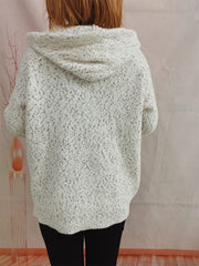 Speckled knit relaxed zip-up hoodie in white with a hooded neckline and long sleeves.