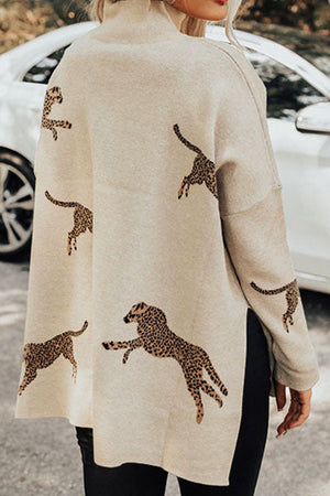 Cream mock neck knit sweater with allover leopard print and side slits.