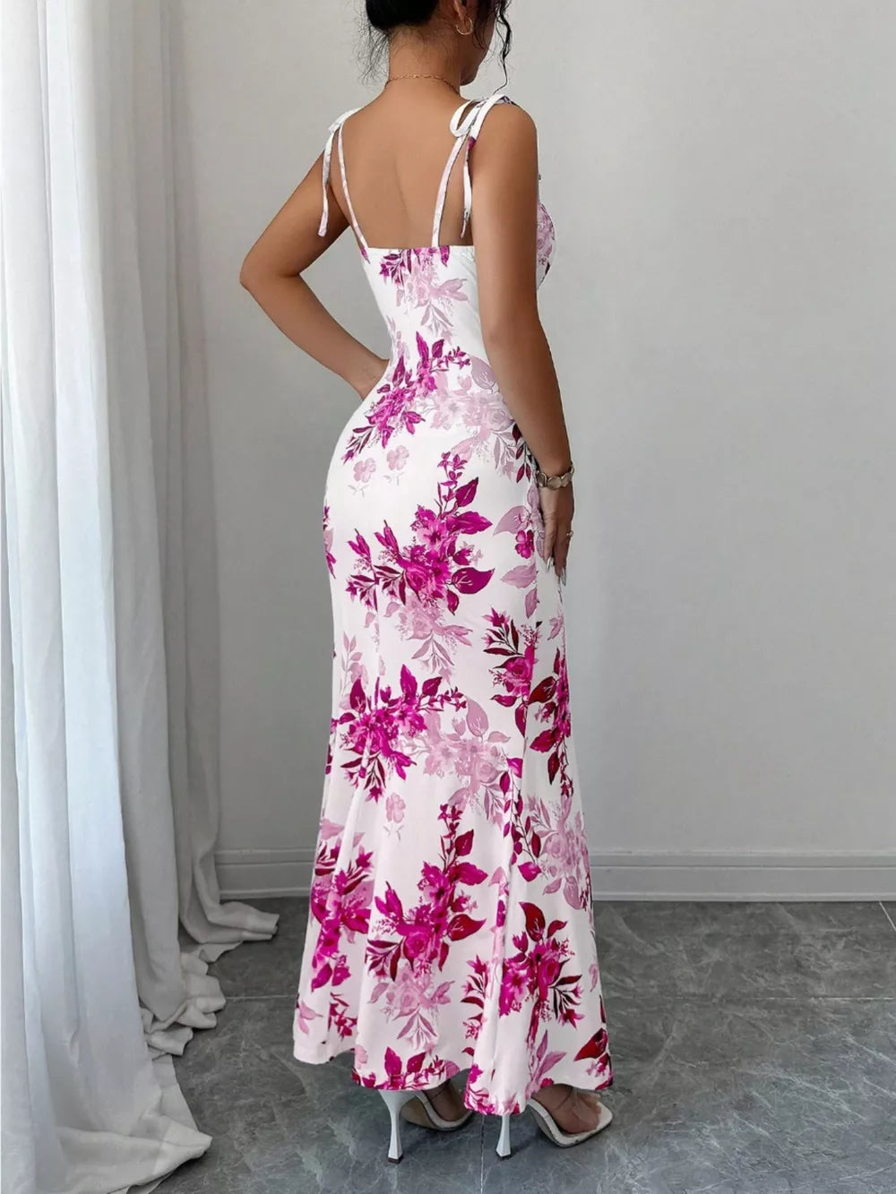 Floral print maxi dress with tie straps and a flared hem.