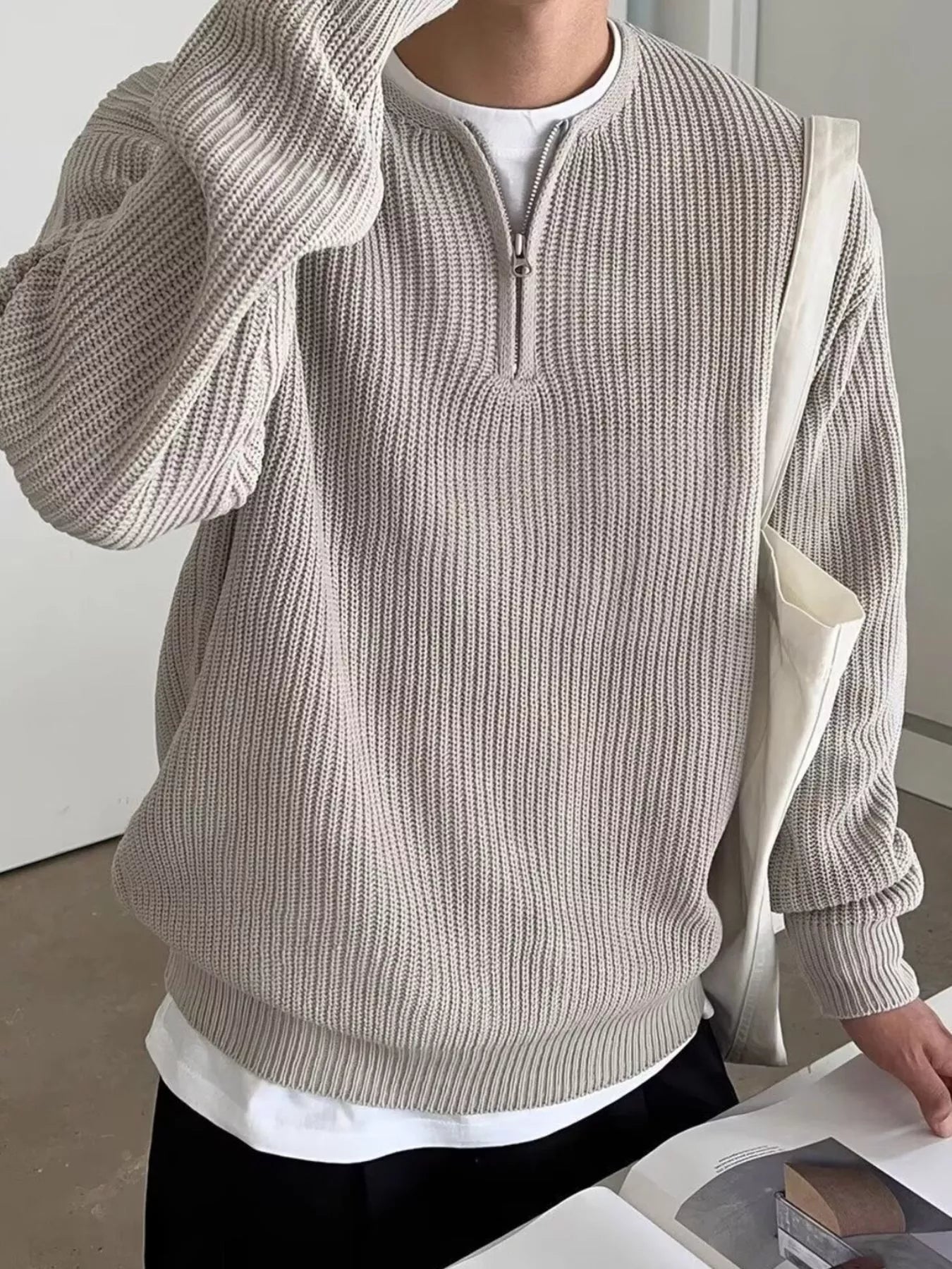 Khaki quarter zip relaxed fit ribbed knit pullover sweater with a white t-shirt layered underneath.