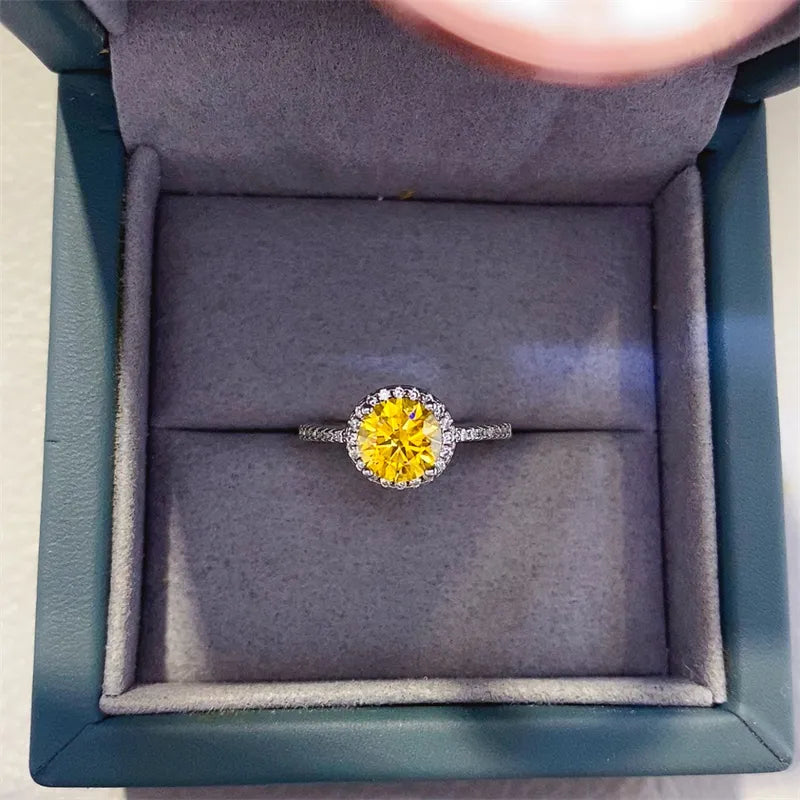 Halo-set canary diamond ring in silver with a diamond-accented band.