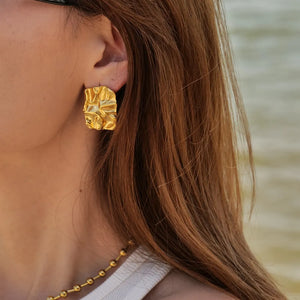 Textured gold sculptural stud earrings with 18K gold plating.