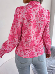 Pink floral print shirred cuff blouse with puff sleeves.