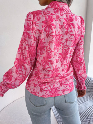Pink floral print shirred cuff blouse with puff sleeves.