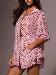 Pink polka dot sheer two-piece set with collared shirt and shorts.