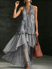 Grey ruffled halter maxi gown with button-down front and sheer tiered skirt.