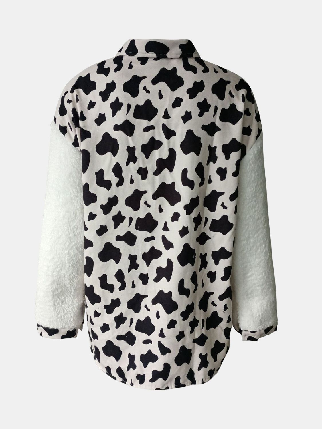 Plaid & Sherpa Hybrid Shacket with cow print body and white sherpa sleeves.