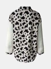 Plaid & Sherpa Hybrid Shacket with cow print body and white sherpa sleeves.