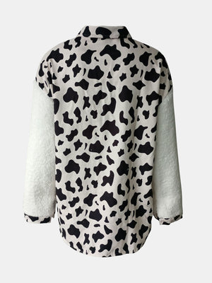 Plaid & Sherpa Hybrid Shacket with cow print body and white sherpa sleeves.