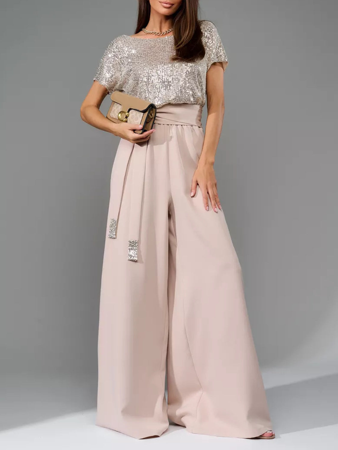 Dusty Pink palazzo pant suit with sequin bodice and embellished belt.