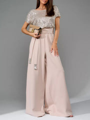 Dusty Pink palazzo pant suit with sequin bodice and embellished belt.