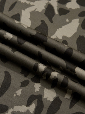 Sleek mock neck tee in a grey camouflage print fabric.