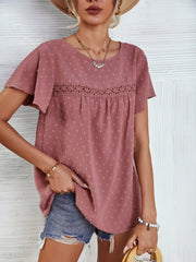 Dusty pink Swiss dot blouse with flutter sleeves and eyelet detail at the yoke.