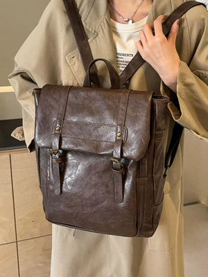 Brown pu leather flap backpack with brass hardware and adjustable straps