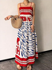 Red and white spaghetti strap maxi dress with blue sardine print and text detail.