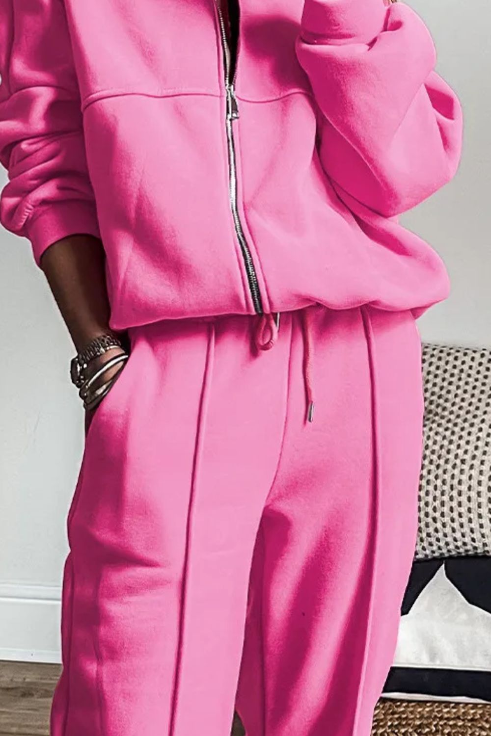 Fuchsia pink seamed jogger set with zip-up jacket and drawstring waist.