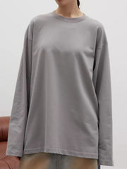 Light gray oversized crewneck sweatshirt with voluminous sleeves and crew neckline.