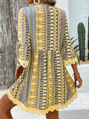 Yellow bohemian printed v-neck dress with bell sleeves and lace trim