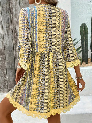 Yellow bohemian printed v-neck dress with bell sleeves and lace trim