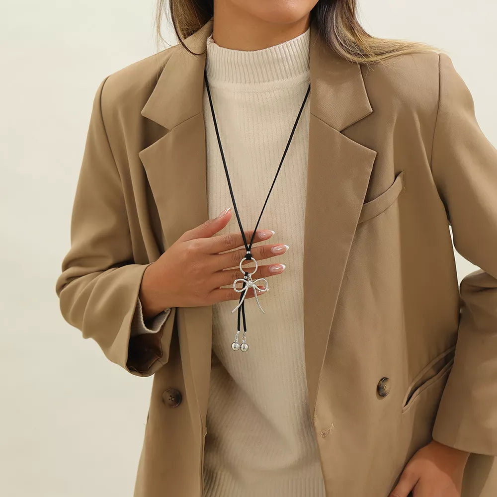 Elegant Bow Pendant Faux Leather Necklace in Silver, model styling view