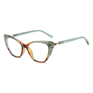Vintage cat eye glasses with tortoise and dark green acetate frames and clear lenses.