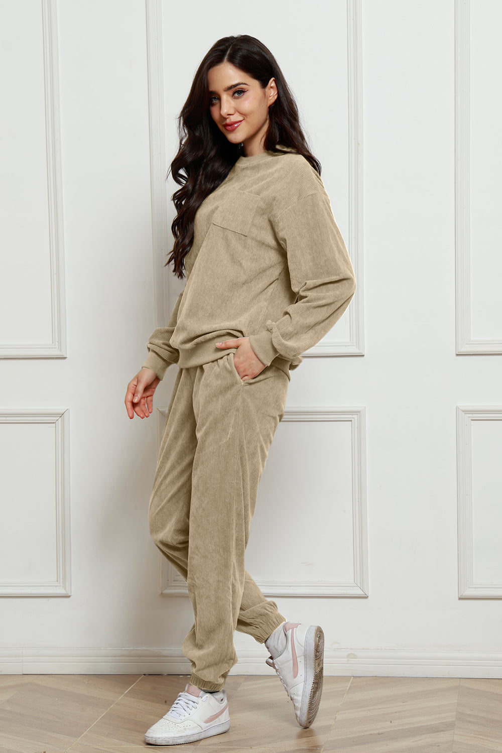 Beige corduroy lounge set with crew neck sweatshirt and jogger pants, featuring a chest pocket.