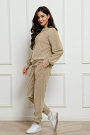 Beige corduroy lounge set with crew neck sweatshirt and jogger pants, featuring a chest pocket.
