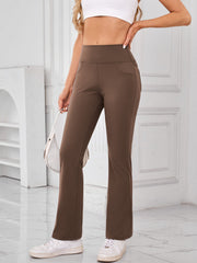Brown flared activewear pants with pocket detail and high waist